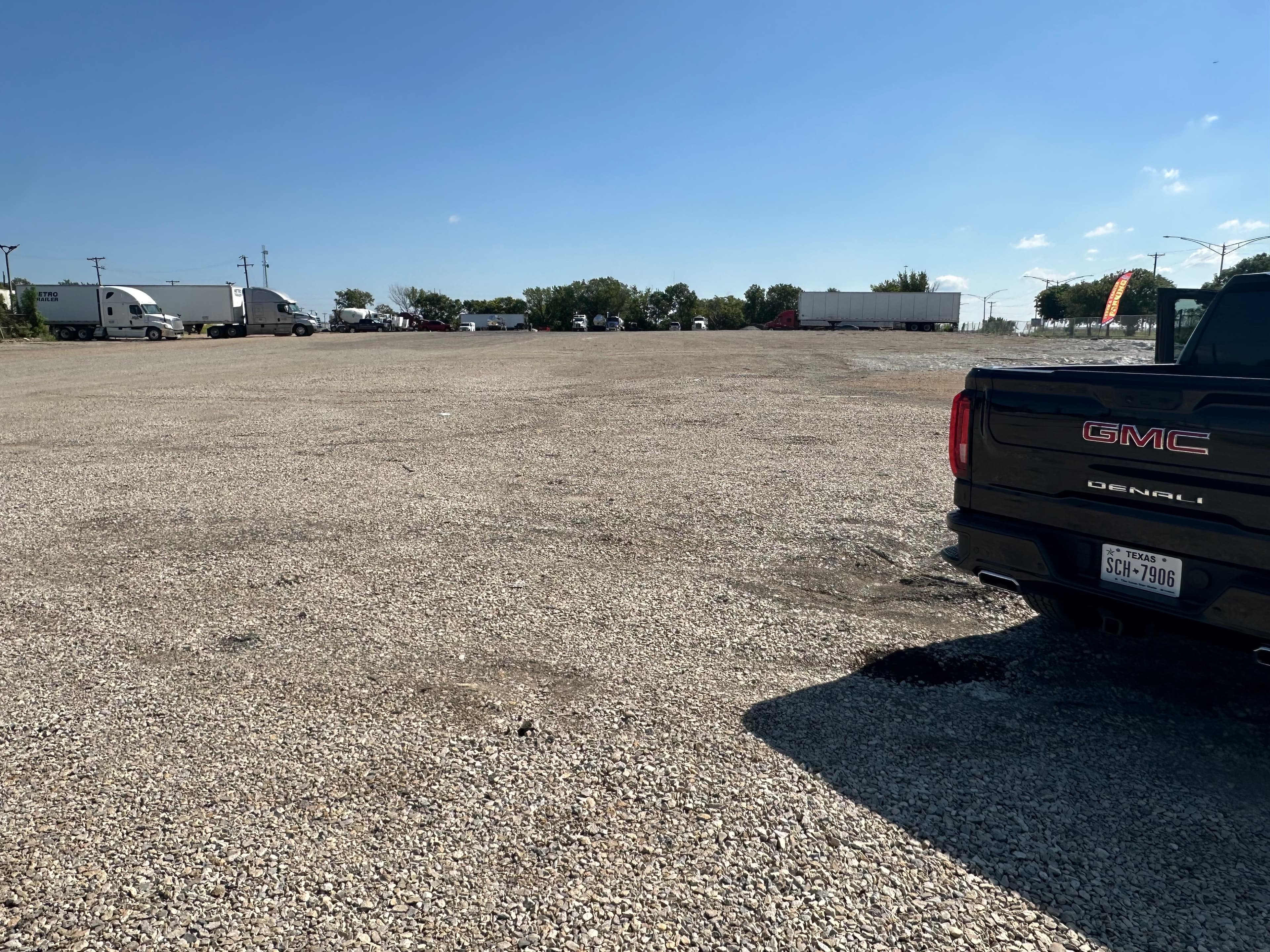 Spacious truck parking area with gravel surface